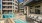 a pool in a courtyard between buildings