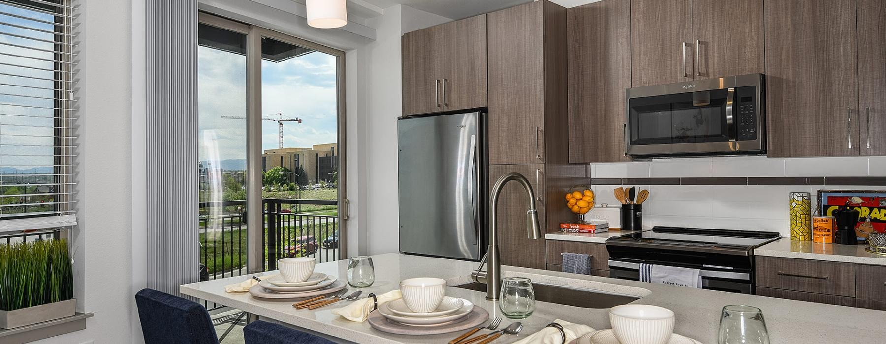 a kitchen with a table set