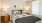 a bedroom with a bed and lamps